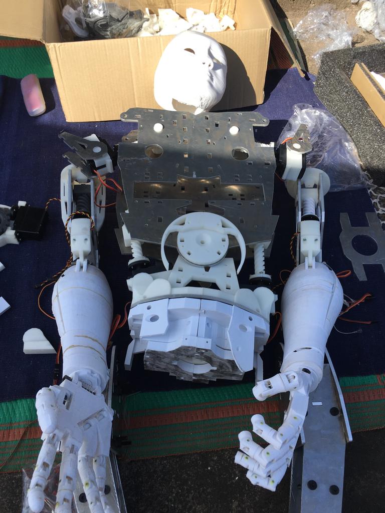 Humanoid robot assembly on a workbench