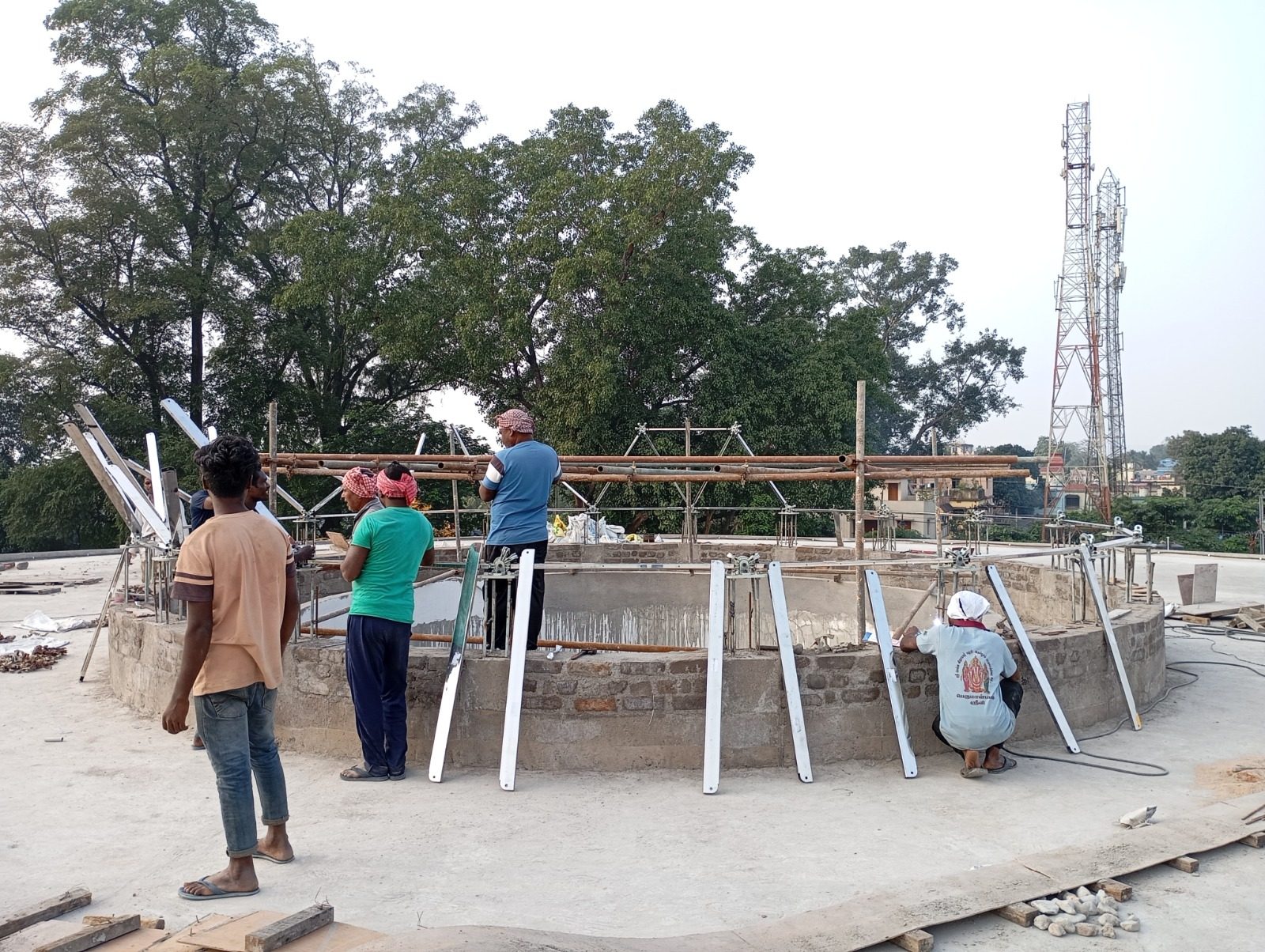 Workers erecting the first geodesic frame members