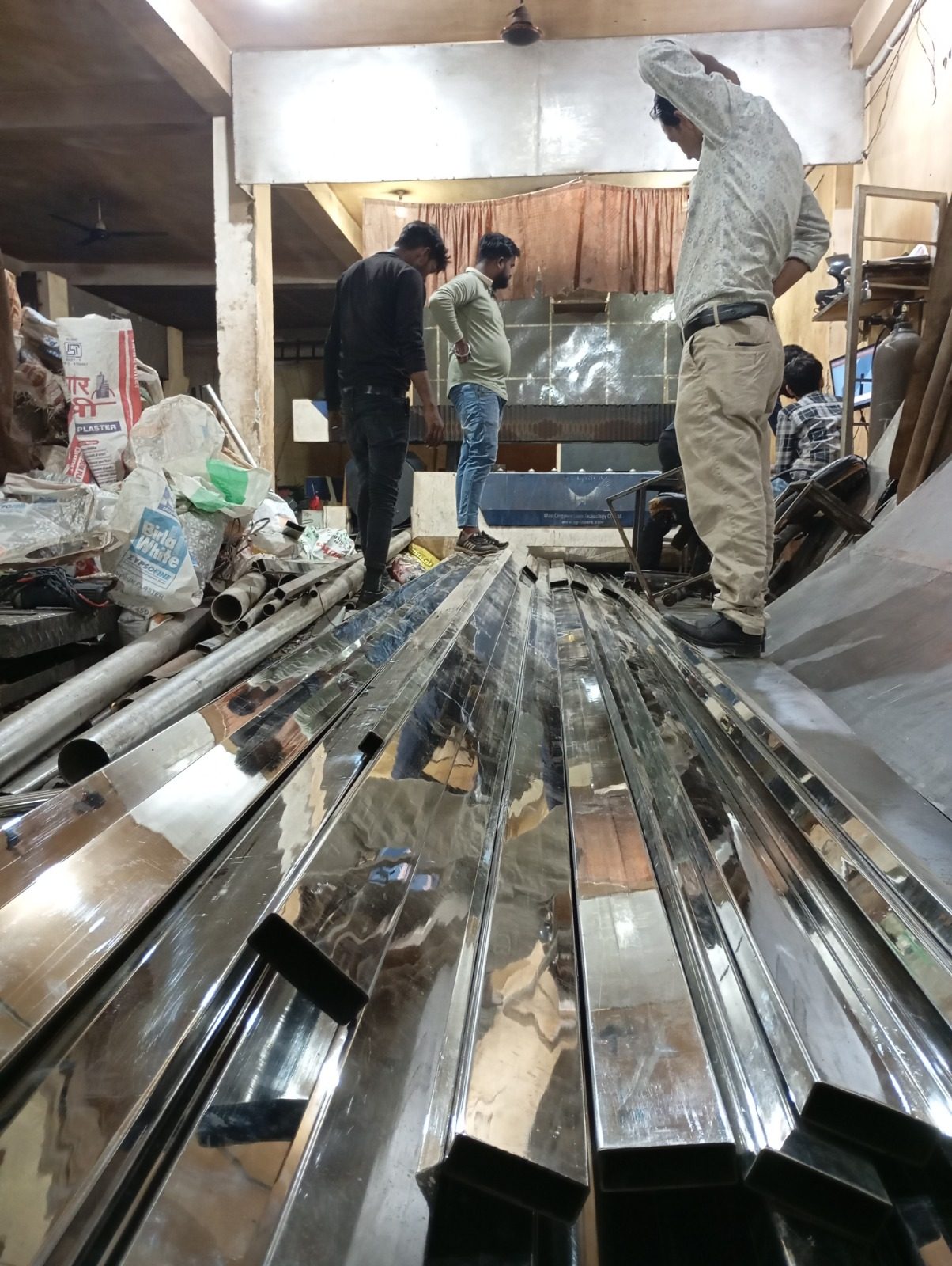 Steel profiles being prepared on the workshop floor