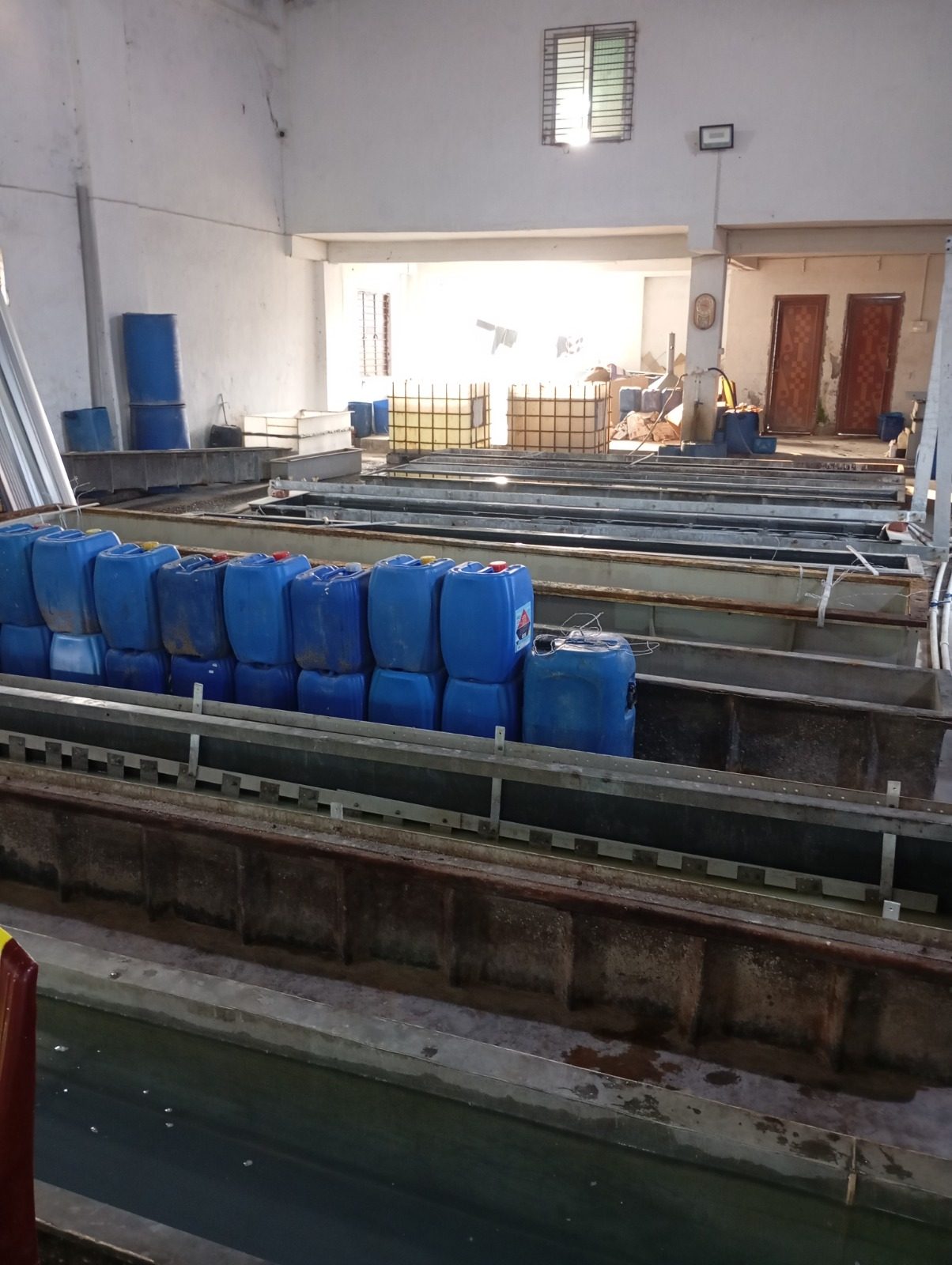 Surface treatment tanks inside the workshop